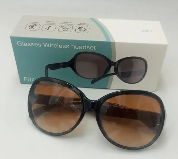 Complete Bluetooth Smart Glasses F07 package with sunglasses, charger, and case